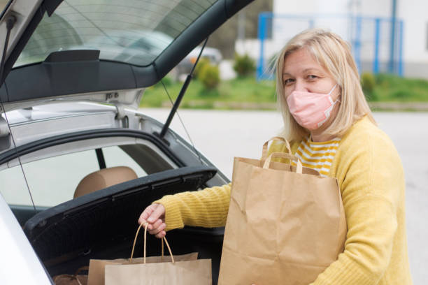 istock Woman holding paper bag 1314378468