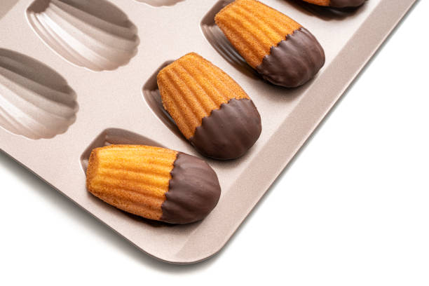 istock Madeleines Homemade and melted chocolate in a mold isolated on white 1314378514
