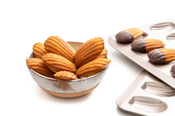 istock Madeleines Homemade bowl and melted chocolate in a mold isolated on white 1314378736