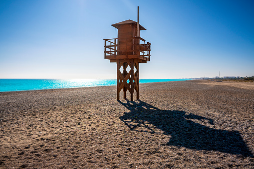 Sagunto Canet beach in Valencia with baywatch tower in blue sky by Mediterranean sea