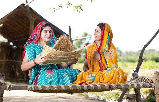 istock Rural women cleaning wheat grain 1314381790