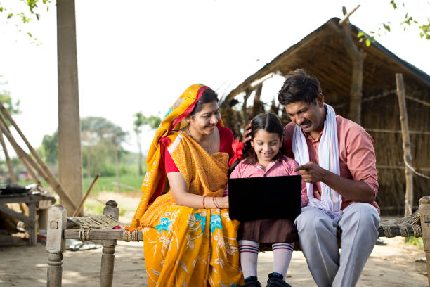 istock Parents with daughter using laptop on traditional bed 1314382795