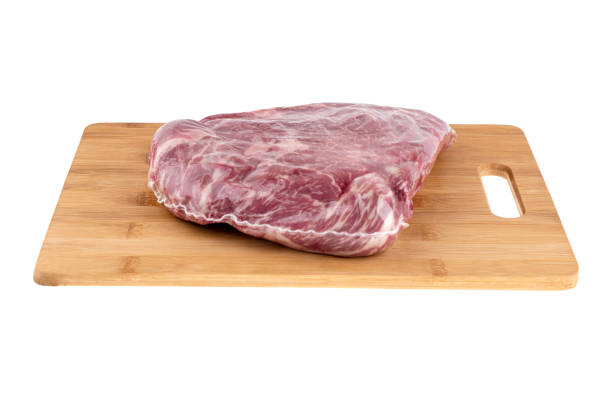istock Vacuum packed meat on a white background. Beef in a vacuum bag on a board close-up. 1314383975
