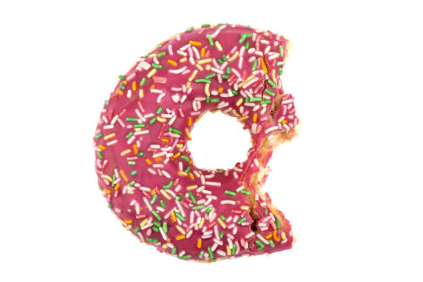 istock Donut close-up on a white background. Bitten donut isolated on white background. 1314383999