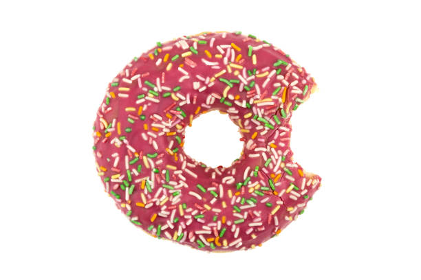 istock Donut close-up on a white background. Bitten donut isolated on white background. 1314384494