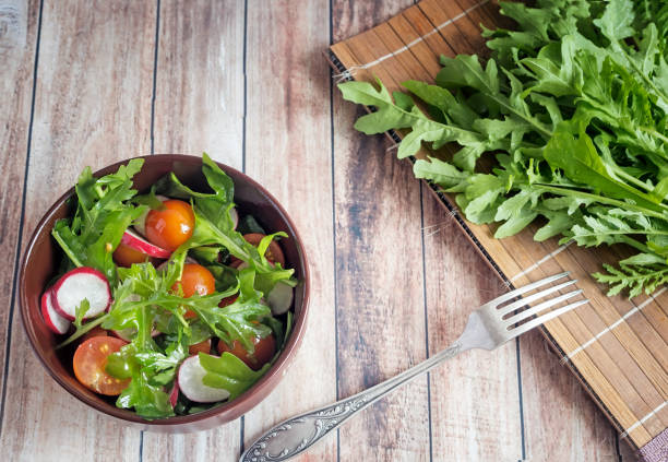 istock Salad of fresh vegetables and herbs on the table. 1314384648
