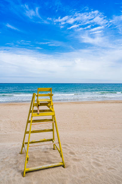 istock Lifeguard chair on empty sand  beach 1314385725