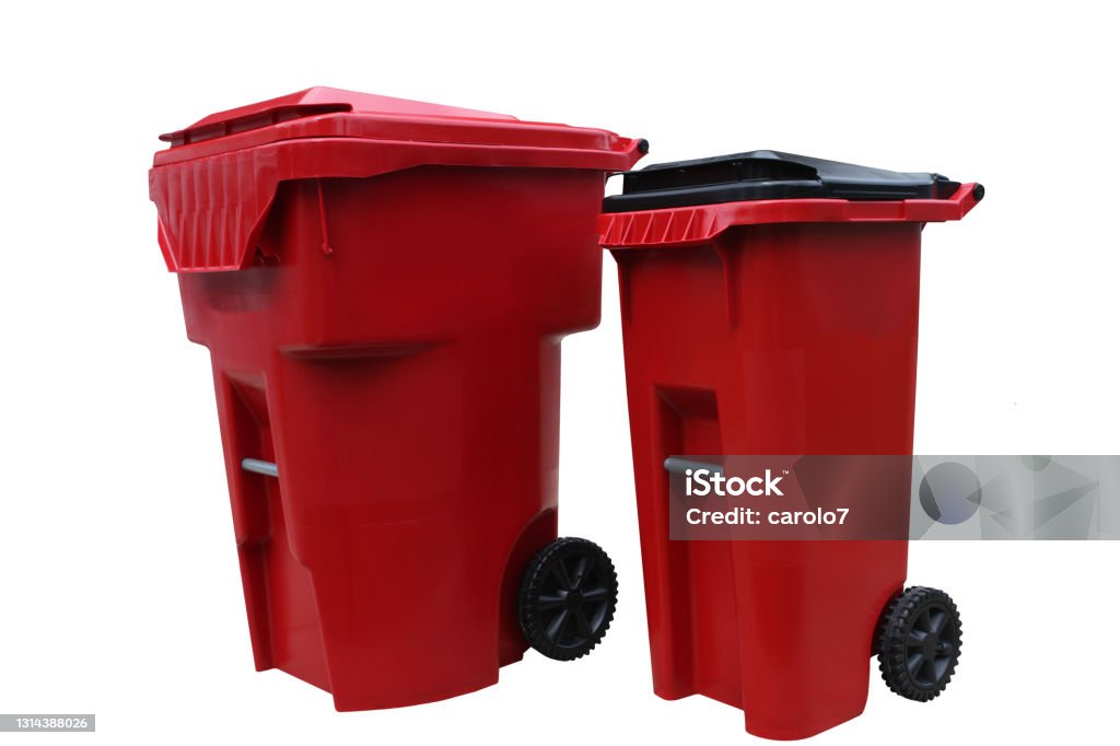Two red garbage cans isolated on white.   With clipping path. Large can is for garbage, smaller can for recycling.   Indiana, USA. Garbage Can Stock Photo