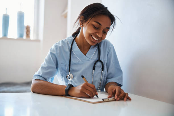 istock Charming female doctor doing paperwork in clinic 1314389439
