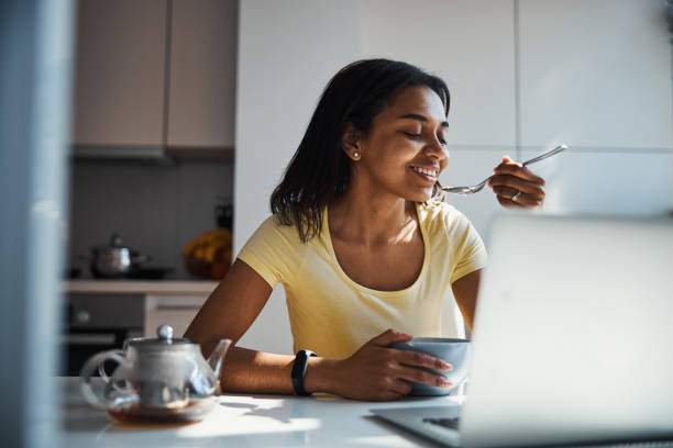 istock Beautiful young woman having breakfast at home 1314392152