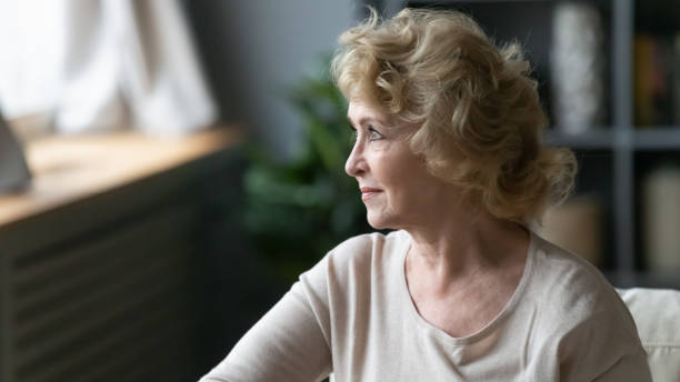 istock Thoughtful middle aged senior mature woman looking away. 1314393130