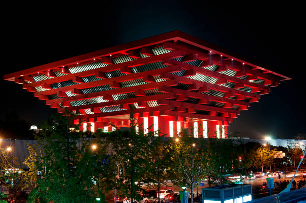 shanghai, china. october 6, 2015. the unique design of the china art museum on the puxi side of shanghai china lit up at night.