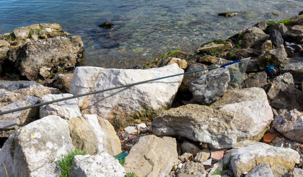 landing net on top a rock in la spezia