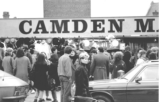 This is a Black and White image of people congregating at the mid 80s Camden Market.