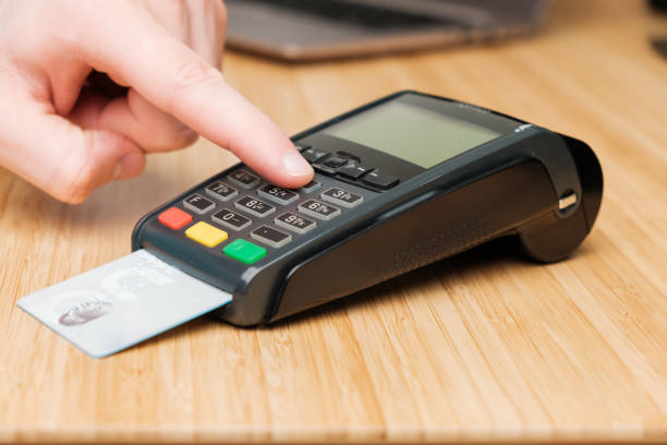 istock Man hand enters pin code on the terminal for payment. 1314396454