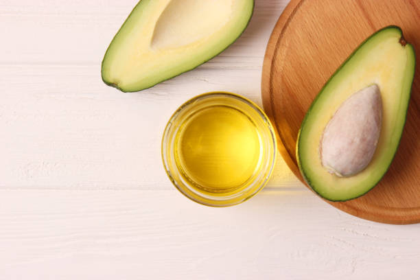 istock Avocado and avocado oil close up on the table 1314399240