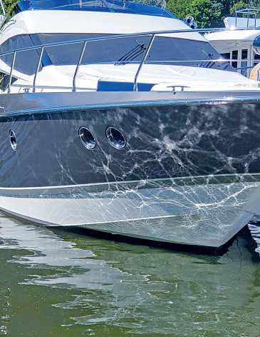 Yacht docked at Saugatuck, Michigan - wave pattern reflecting off the water