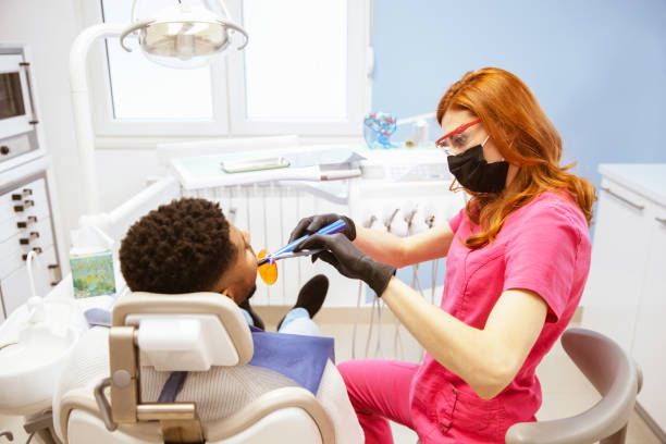 istock Young African-American man at dental office 1314405232