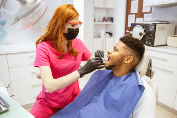 istock Young African-American man at dental office 1314405275