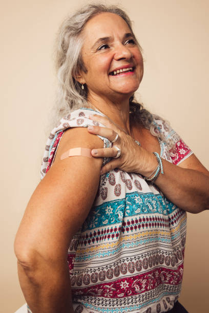 istock Senior woman after receiving vaccination 1314405686