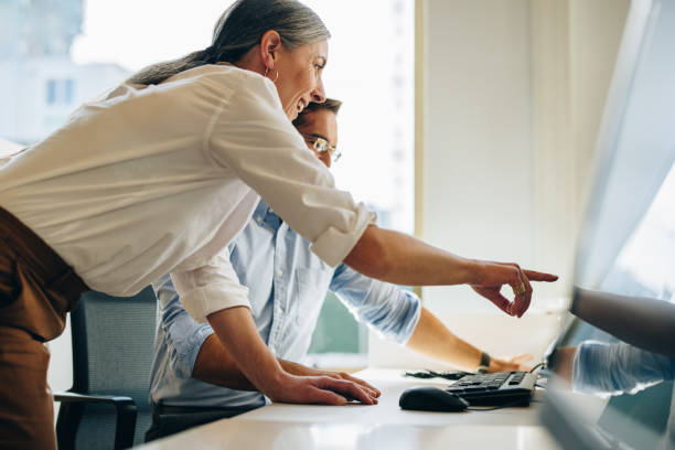 istock Manager suggesting some changes on the report to coworker 1314406739