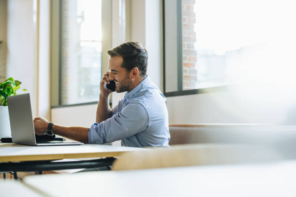 istock Man in office on cell phone 1314406891