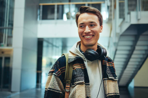istock Male student in high school with headphones 1314406943