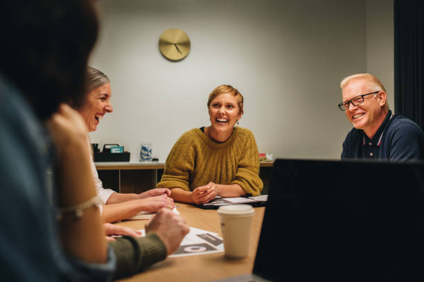 istock Cheerful colleagues looking happy in meeting 1314408455