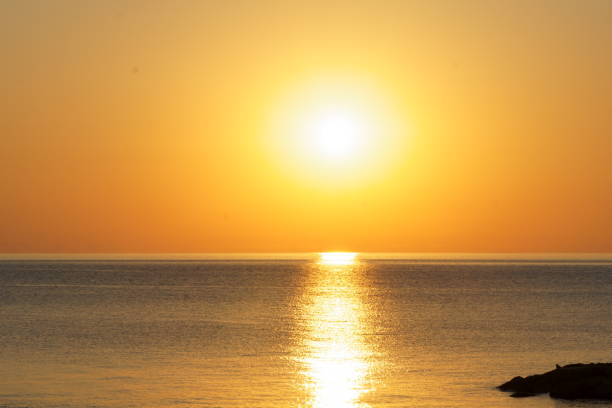 istock Sunrise over the calm sea 1314408687