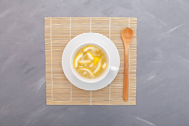 Yujacha (yuja tea or yuzu tea) - Traditional Korean citron tea. Top view, grey background, copy space