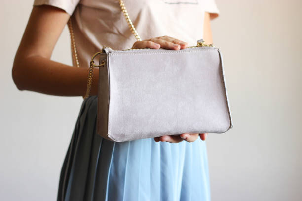 istock girl holding a woman's bag in her hands 1314415464