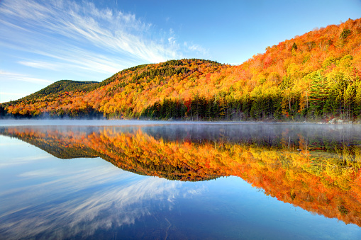 Upper Hall Pond in the White Mountains of New Hampshire. The White Mountains are a mountain range covering about a quarter of the state of New Hampshire and a small portion of western Maine in the United States.