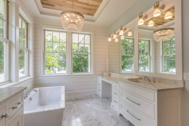 Gorgeous master bathroom with wood tray ceiling Free standing bathtub and white shiplap walls bathroom stock pictures, royalty-free photos & images
