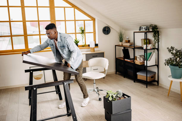 istock Setting up desk in his new home office setup 1314417297