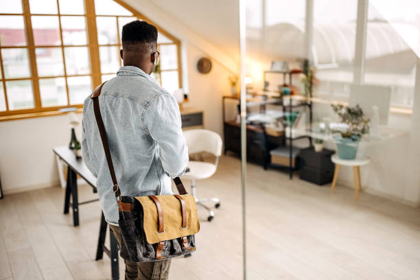 istock Young handsome man entering in his small home office 1314418117