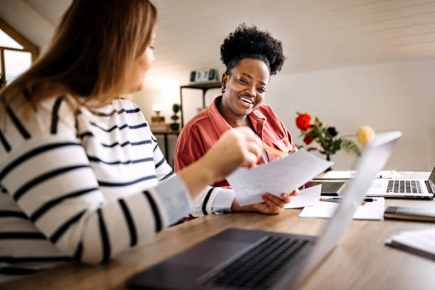 istock Two young woman working together in their small home office setup 1314418171