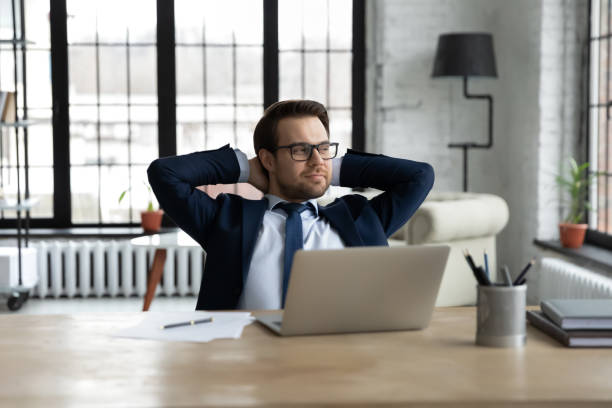 istock Happy male CEO relax in office making plans 1314422846