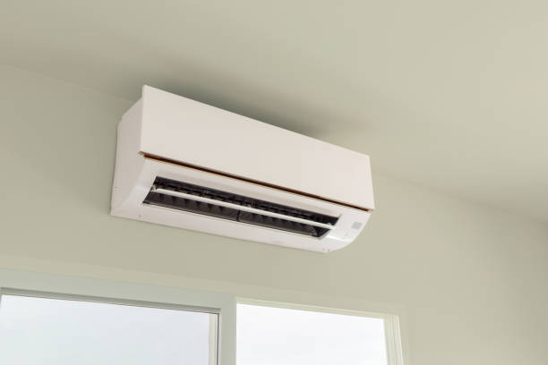 istock Air conditioner on white wall room interior background 1314423634