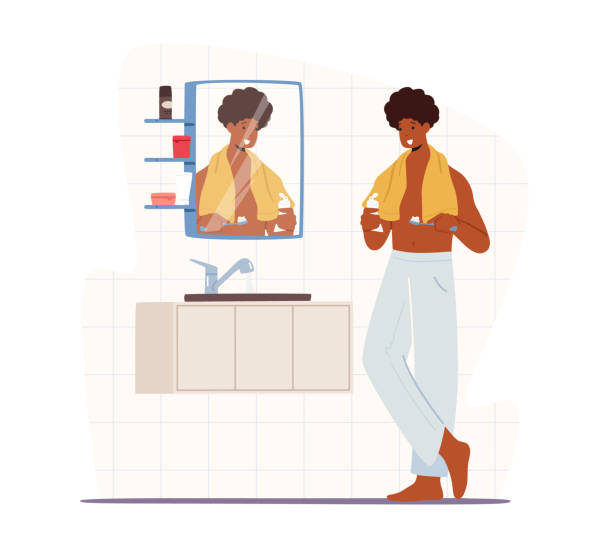 Man Brushing Teeth. Young Handsome African Male Character in Nightwear with Towel Stand front of Mirror and Sink Man Brushing Teeth. Young Handsome African Male Character in Nightwear with Towel Stand front of Mirror and Sink Applying Every Day Hygiene Routine Procedure in Bathroom. Cartoon Vector Illustration black man brushing teeth stock illustrations