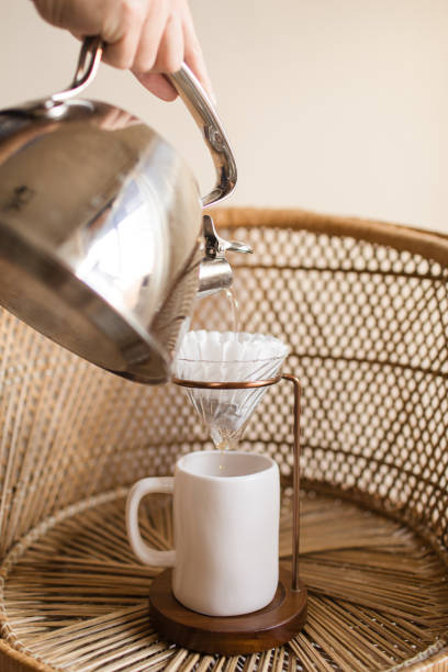 istock Making a Hot Pour Over Coffee in a Mid-Century Modern & Boho Style With a Rattan Background 1314426012