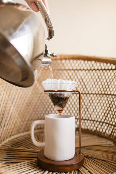 istock Making a Hot Pour Over Coffee in a Mid-Century Modern & Boho Style With a Rattan Background 1314426207