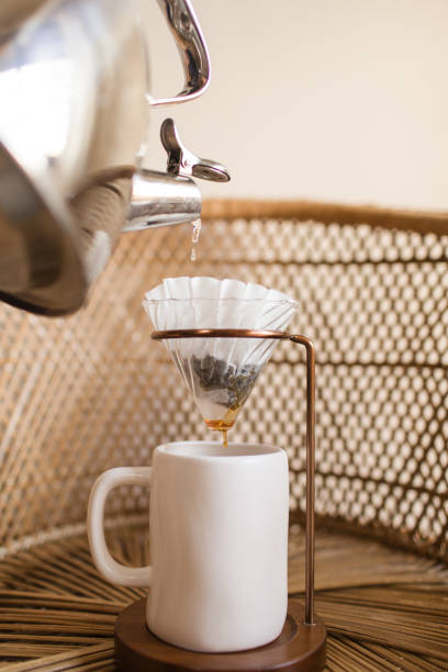 istock Making a Hot Pour Over Coffee in a Mid-Century Modern & Boho Style With a Rattan Background 1314426332