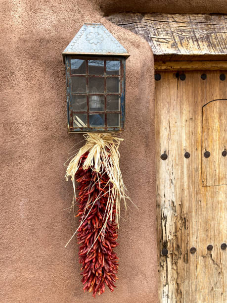 istock Santa Fe Style: Adobe Wall, Antique Door, Hanging Ristra 1314427942