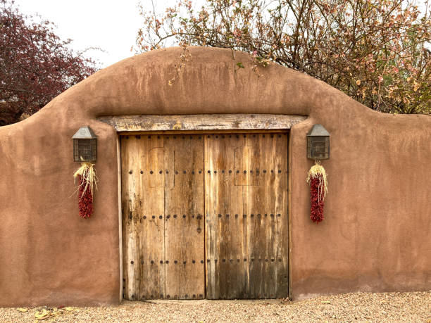 Santa Fe Style: Arched Adobe Wall, Antique Door, Ristras