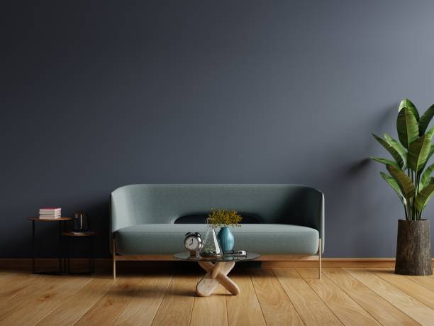 istock Interior of light room with sofa on empty dark blue wall background. 1314433434