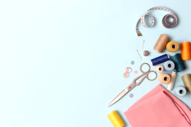 istock Set of different sewing accessories on a colored background close-up 1314434853