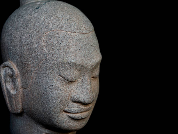 istock Head of Buddha carved from stone. 1314435109