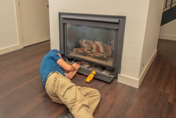 Service technician working on a fireplace stock photo