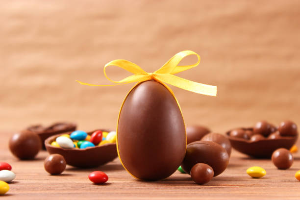 istock Easter composition with chocolate eggs and chocolate rabbit on wooden background 1314437380