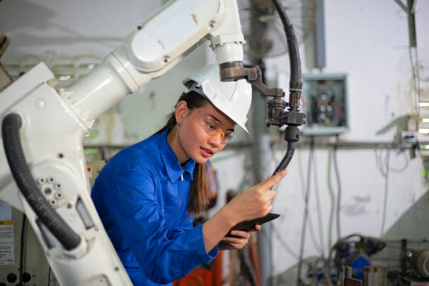 istock Woman mechanic repairing a robot machine. 1314440678